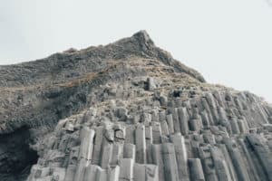 Black sand beach basalt rock columns